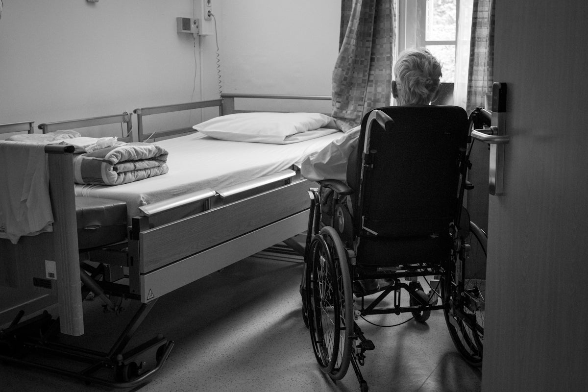 a person in a wheelchair in a room